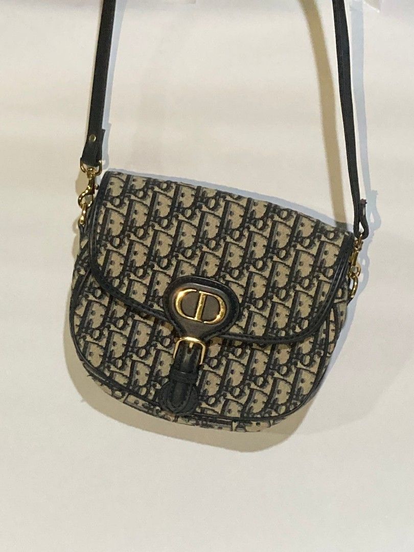 Dior Bobby Bag with serial (Category: Luxury Bags & Wallets) located in Taguig. Submitted by blessedlupie (Listing ID 1422027946, Image 1). Description: - Nga Dior Saddle Bag - Iconic Dior Oblique pattern - Flap closure with 'CD' buckle - Blue leather strap replaced - Gold-tone hardware -with serial on gold.