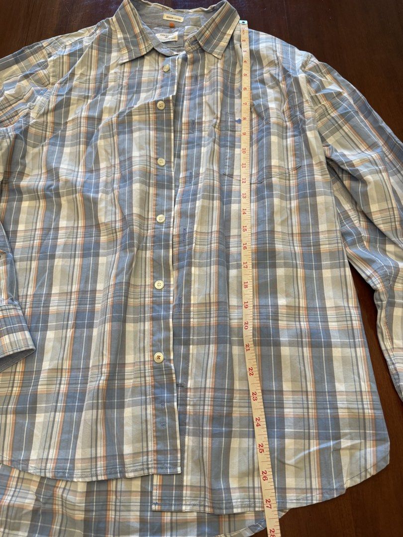 Dockers Modern Classic Plaid Shirt (Category: Tshirts & Polo Shirts ) located in Mandaue City. Submitted by marginiz (Listing ID 1421954189, Image 2). Description: - Dockers Modern Classic shirt - Plaid pattern: Blue, white, and orange - Size: M/M - Features: Button-down closure, chest pocket, long sleeves - Measurements: Approximately 28" length, 21" chest - Made in Vietnam.