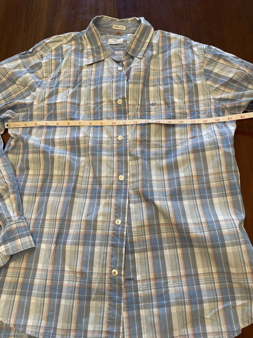 Dockers Modern Classic Plaid Shirt (Category: Tshirts & Polo Shirts ) located in Mandaue City. Submitted by marginiz (Listing ID 1421954189, Image 3). Description: - Dockers Modern Classic shirt - Plaid pattern: Blue, white, and orange - Size: M/M - Features: Button-down closure, chest pocket, long sleeves - Measurements: Approximately 28" length, 21" chest - Made in Vietnam.