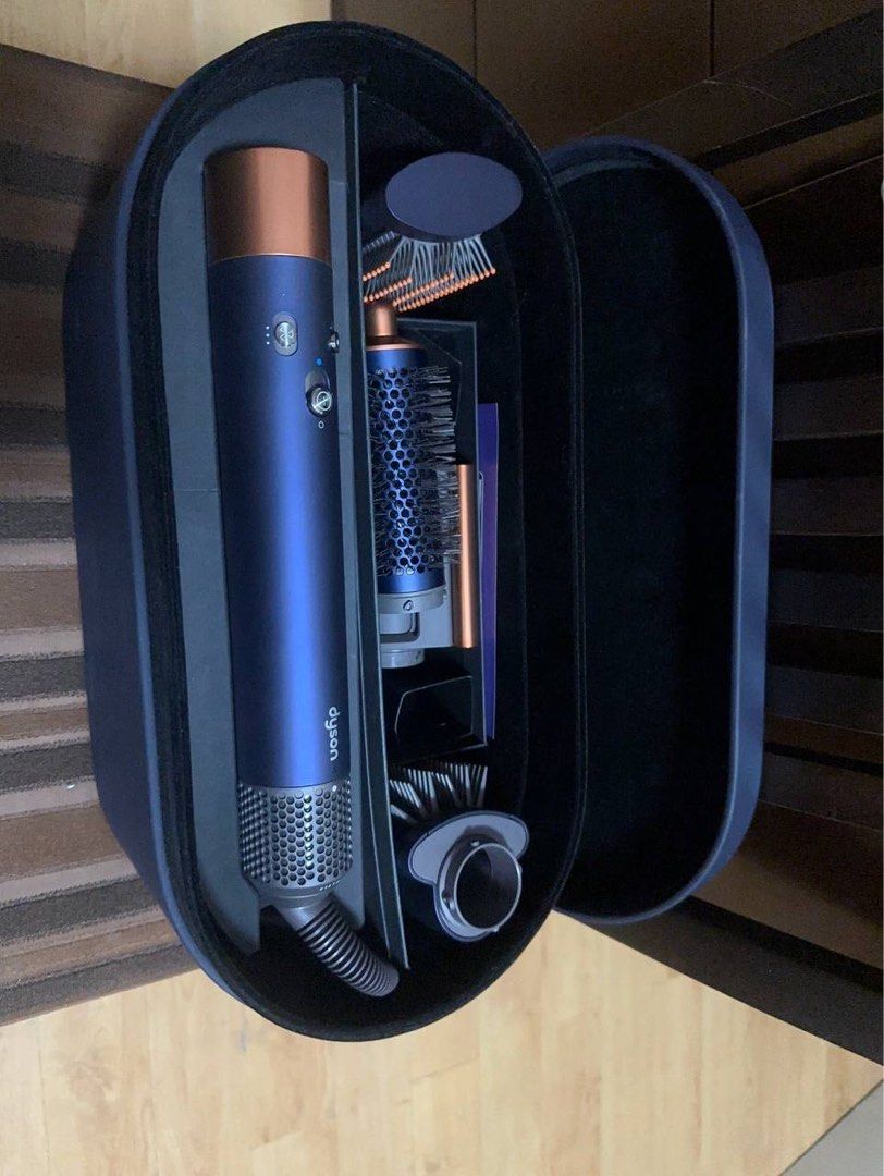 [NEGOTIABLE] Dyson Airwrap Complete Long - Blue/Copper (Category: Hair) located in Imus. Submitted by dffabellon (Listing ID 1421949242, Image 1). Description: - Dyson Airwrap Complete Long styler - Includes long barrel, smoothing brushes, and other styling tools - Comes with a navy blue case - Includes original manuals - Color: Blue and copper.
