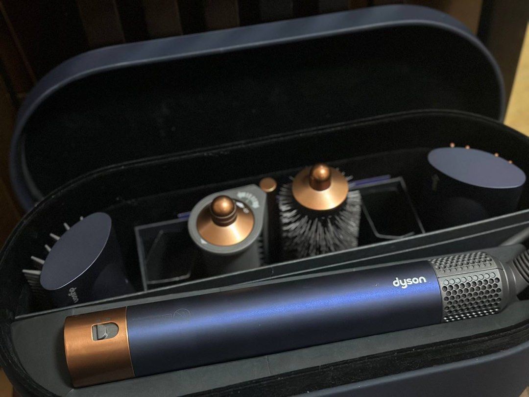 [NEGOTIABLE] Dyson Airwrap Complete Long - Blue/Copper (Category: Hair) located in Imus. Submitted by dffabellon (Listing ID 1421949242, Image 2). Description: - Dyson Airwrap Complete Long styler - Includes long barrel, smoothing brushes, and other styling tools - Comes with a navy blue case - Includes original manuals - Color: Blue and copper.