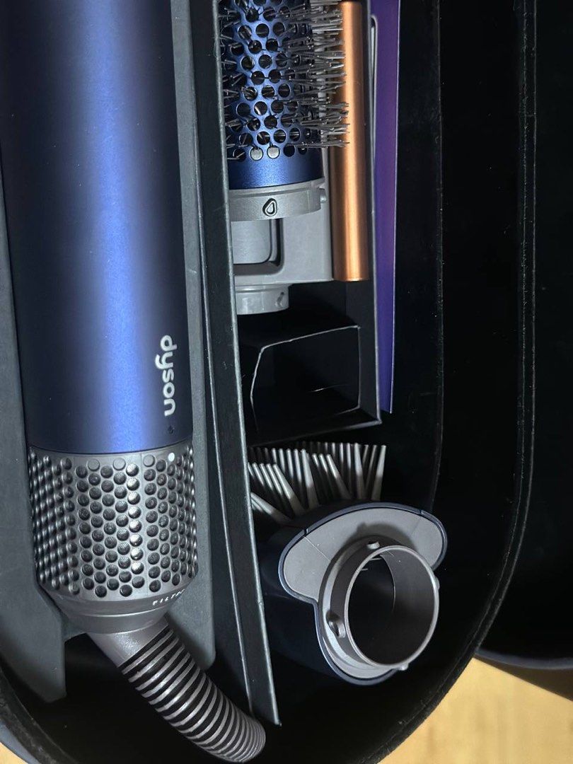 [NEGOTIABLE] Dyson Airwrap Complete Long - Blue/Copper (Category: Hair) located in Imus. Submitted by dffabellon (Listing ID 1421949242, Image 3). Description: - Dyson Airwrap Complete Long styler - Includes long barrel, smoothing brushes, and other styling tools - Comes with a navy blue case - Includes original manuals - Color: Blue and copper.