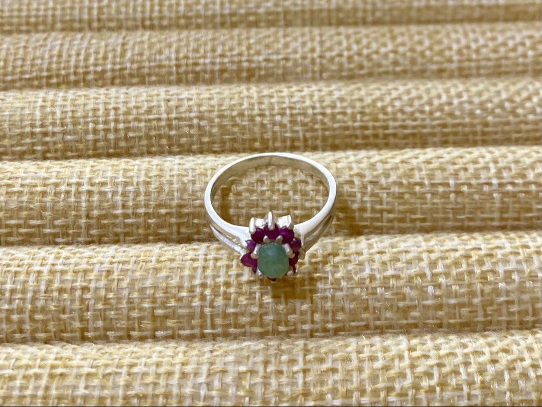 Emerald and Ruby Gemstone Ring | S925 (Category: Rings) located in Solano. Submitted by silvershineph (Listing ID 1421947636, Image 3). Description: ✧ Product / Item Name: Emerald and Ruby Gemstone Ring ✧ Description: It features a central oval-cut light green gemstone, identified as an emerald in similar designs. This central stone is surrounded by a cluster of smaller, vibrant pink-red gemstones, which are rubies. ✧ Size: 7 ✧ Weight: 2.5g ✧ Det