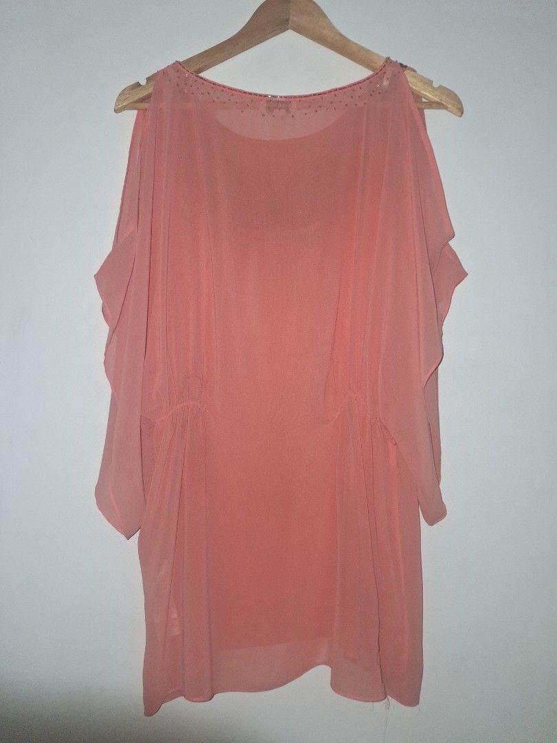 Ever New Cold Shoulder Top (Category: Blouses) located in Quezon City. Submitted by cncarousel (Listing ID 1422018071, Image 2). Description: - Ever New top in a lovely peach color - Stylish cold shoulder design - Size: M - Elegant beaded embellishment around the neckline - Comfortable gathered waist - Flowy, flattering sleeves.