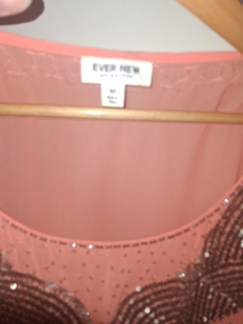 Ever New Cold Shoulder Top (Category: Blouses) located in Quezon City. Submitted by cncarousel (Listing ID 1422018071, Image 3). Description: - Ever New top in a lovely peach color - Stylish cold shoulder design - Size: M - Elegant beaded embellishment around the neckline - Comfortable gathered waist - Flowy, flattering sleeves.