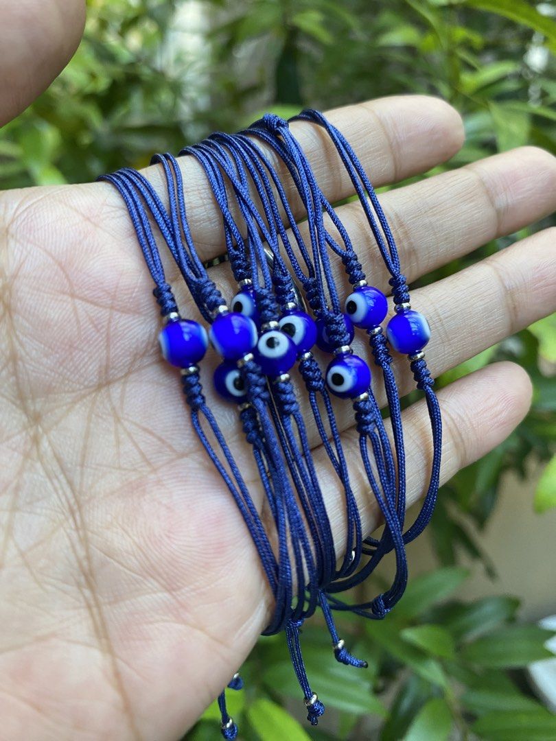 Evil Eye String Bracelets - Red and Blue (Category: Bracelets) located in General Trias. Submitted by artycles (Listing ID 1422014014, Image 2). Description: - Evil eye bead bracelets - Available in red and blue string colors - Adjustable size - Multi-strand design - Stylish and protective.