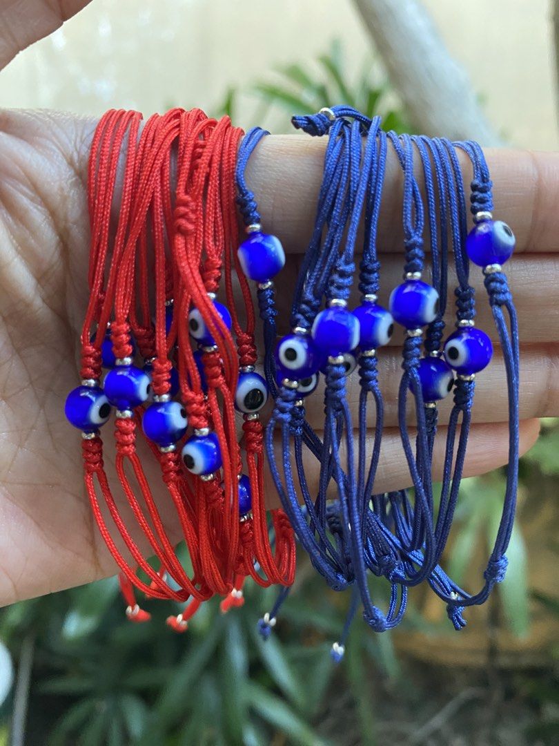 Evil Eye String Bracelets - Red and Blue (Category: Bracelets) located in General Trias. Submitted by artycles (Listing ID 1422014014, Image 1). Description: - Evil eye bead bracelets - Available in red and blue string colors - Adjustable size - Multi-strand design - Stylish and protective.