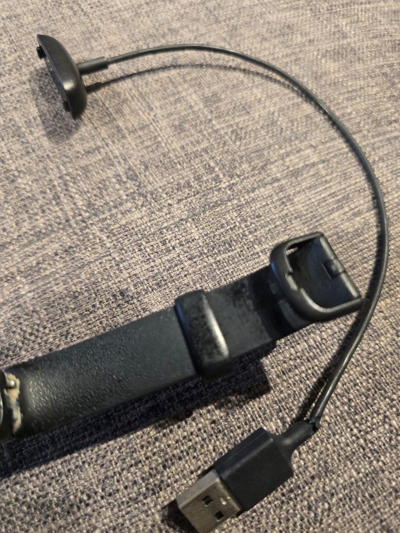 Fitbit Inspire HR Fitness Tracker (Category: Wearables & Smart Watches) located in Makati City. Submitted by everydaytrinkets (Listing ID 1422032520, Image 3). Description: - Black Fitbit Inspire HR fitness tracker - Displays time and other metrics - Black band with adjustable holes - Includes charging cable - In good working condition -strap shows sign of use -price is negotiable.