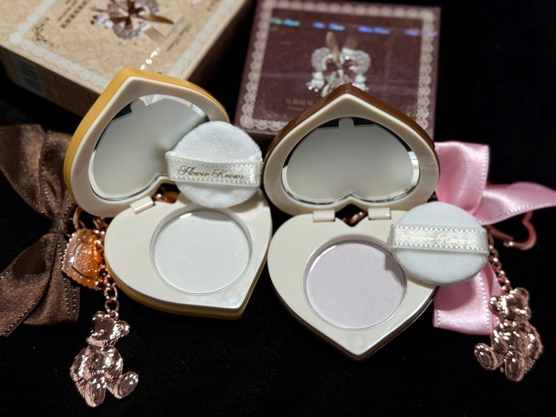 Flower Knows Heart-Shaped Powder Compact (Category: Makeup) located in Manila. Submitted by n4thlie (Listing ID 1422052255, Image 3). Description: - Flower Knows heart-shaped powder compact - Unique waffle design - Includes a matching teddy bear charm and ribbon - Features a mirror and powder puff - Available in two colors: - Brown waffle design - Yellow waffle design.