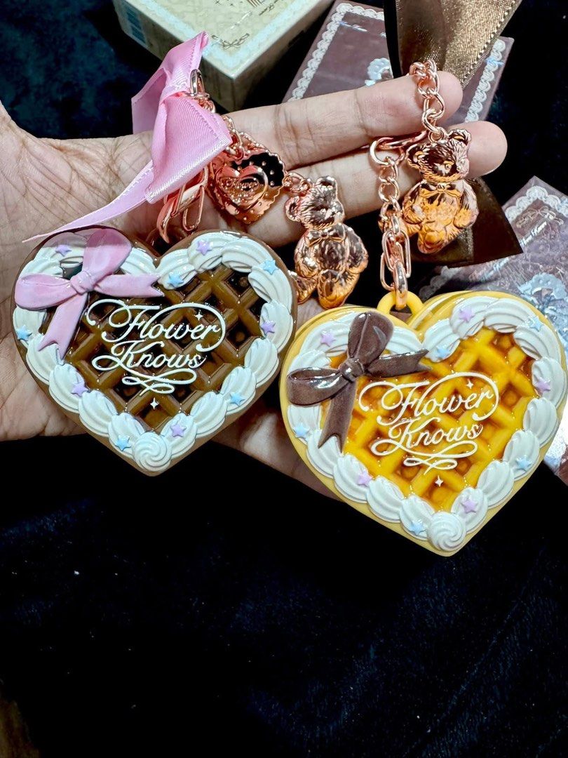 Flower Knows Heart-Shaped Powder Compact (Category: Makeup) located in Manila. Submitted by n4thlie (Listing ID 1422052255, Image 2). Description: - Flower Knows heart-shaped powder compact - Unique waffle design - Includes a matching teddy bear charm and ribbon - Features a mirror and powder puff - Available in two colors: - Brown waffle design - Yellow waffle design.