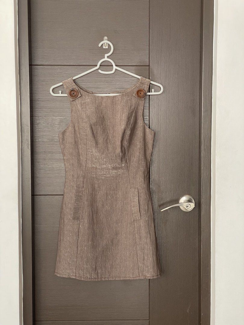 Garfunkle | Brown Dress - Size 10 (Category: Dresses) located in Muntinlupa City. Submitted by thea.laurel (Listing ID 1421956645, Image 1). Description: - Garfunkle Australia dress - Size 10 - Sleeveless design - Shoulder button details - Fitted silhouette - Zipper closure at back - Versatile neutral color.