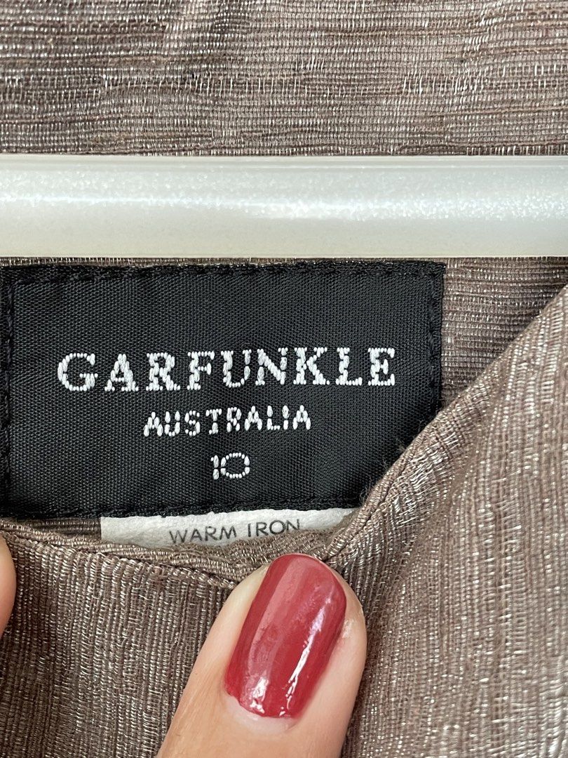 Garfunkle | Brown Dress - Size 10 (Category: Dresses) located in Muntinlupa City. Submitted by thea.laurel (Listing ID 1421956645, Image 3). Description: - Garfunkle Australia dress - Size 10 - Sleeveless design - Shoulder button details - Fitted silhouette - Zipper closure at back - Versatile neutral color.