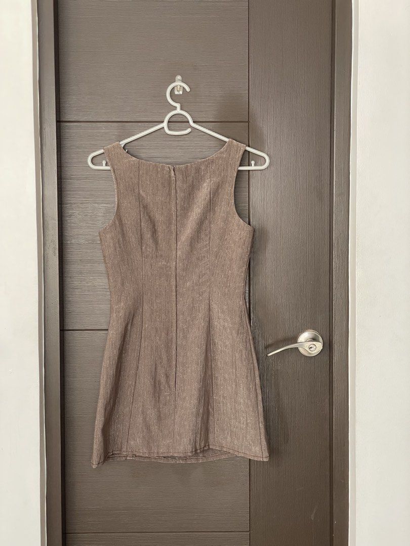Garfunkle | Brown Dress - Size 10 (Category: Dresses) located in Muntinlupa City. Submitted by thea.laurel (Listing ID 1421956645, Image 2). Description: - Garfunkle Australia dress - Size 10 - Sleeveless design - Shoulder button details - Fitted silhouette - Zipper closure at back - Versatile neutral color.