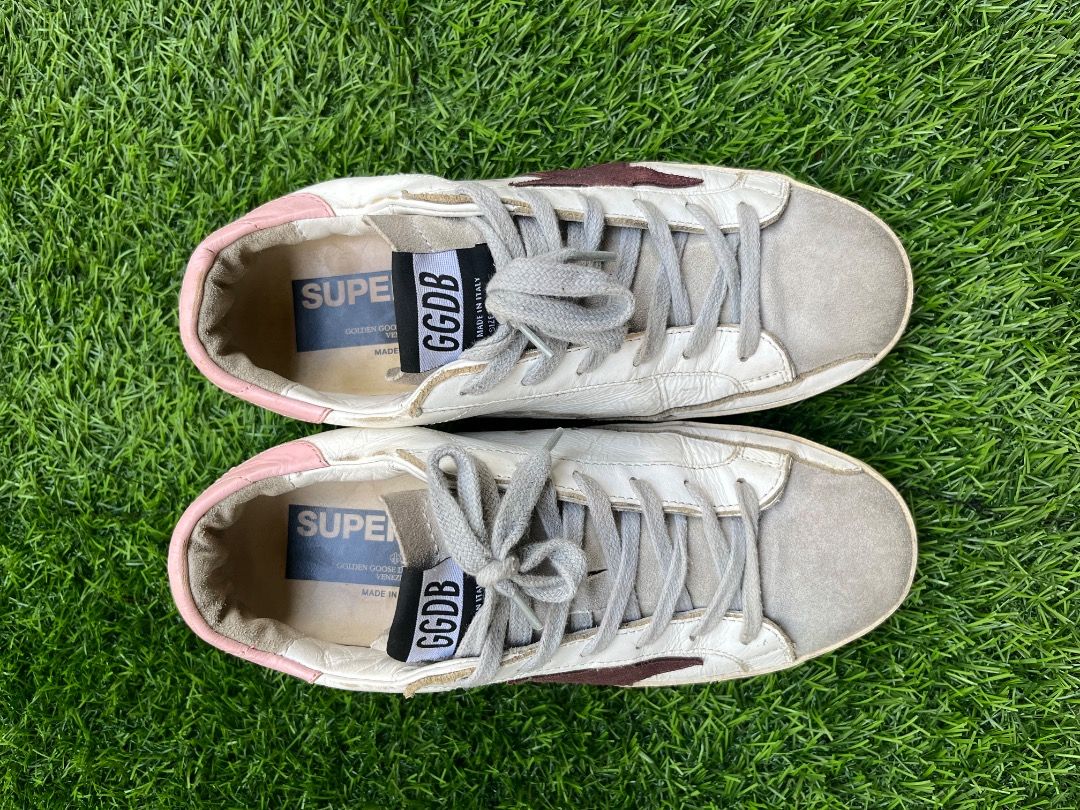 Golden Goose Superstar Sneakers (Category: Sneakers) located in Davao. Submitted by twistedswagger (Listing ID 1421942572, Image 2). Description: - Golden Goose Superstar sneakers - White leather upper - Burgundy star detail - Suede toe cap - Pink heel tab - Grey laces - Made in Italy.