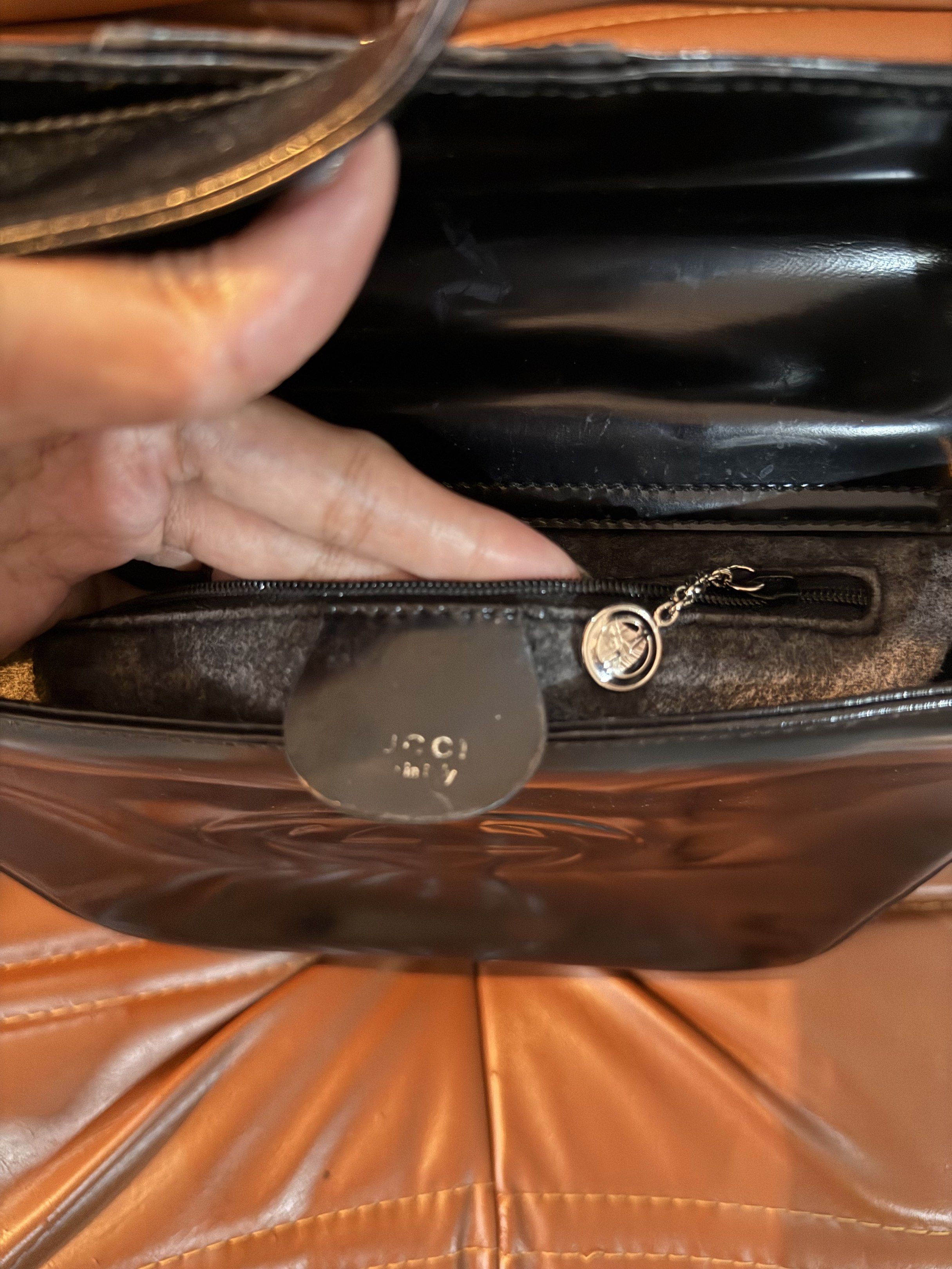 Gucci G Vintage Top Bag (Category: Luxury Bags & Wallets) located in Pateros City. Submitted by norskieonlineshop (Listing ID 1421948847, Image 3). Description: This Gucci Interlocking G Vintage Top Handle Shoulder Bag is crafted from black box leather, showcasing a classic and elegant design. The bag features a magnetic closure, silver hardware, and a shoulder strap with a 6-inch drop. With dimensions of 7.5 inches in width, 6.25 inches in heigh