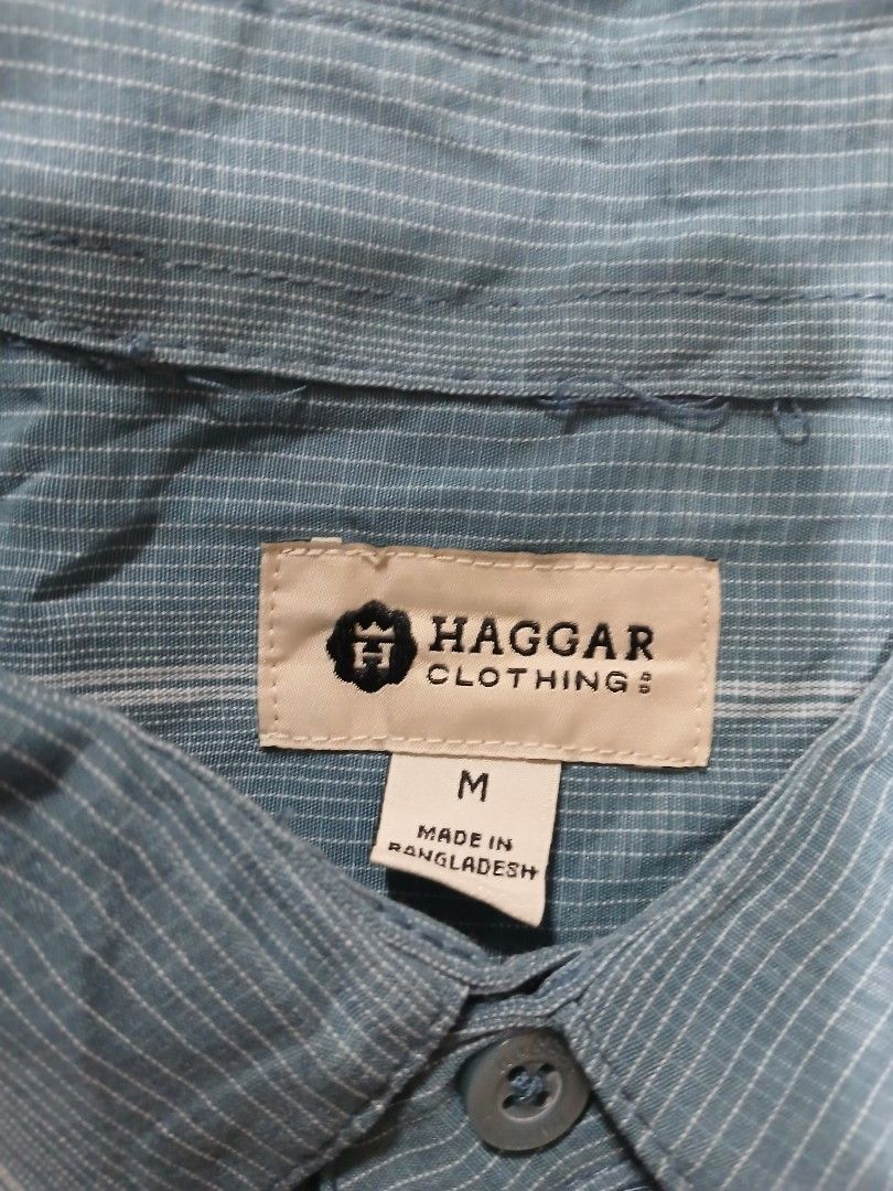 Haggar Striped Button-Down Shirt - Medium (Category: Tshirts & Polo Shirts ) located in Caloocan City. Submitted by erickaban14 (Listing ID 1421942177, Image 2). Description: - Haggar button-down shirt - Light blue with white stripes - Size: Medium - Made in Bangladesh - Features: - Collared neckline - Two chest pockets - Button-up closure - Long sleeves.