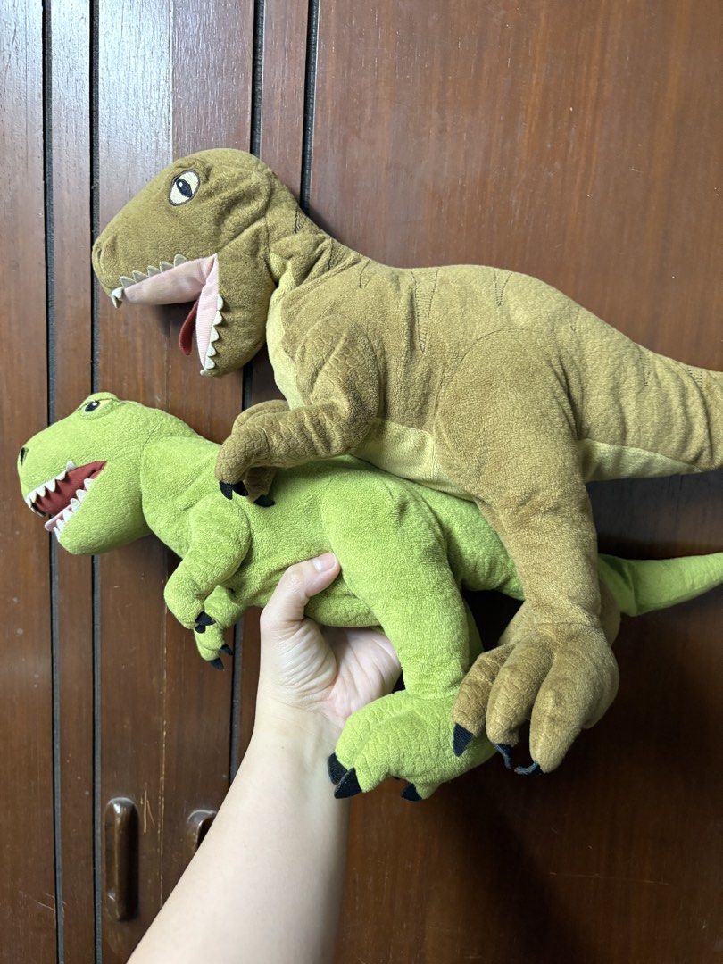 Ikea Dinosaur Plush Toys (Category: Plushies & Soft Toys) located in San Juan City. Submitted by mksb0112 (Listing ID 1421988300, Image 2). Description: - Two dinosaur plush toys - Colors: Green and Brown - Detailed features: claws, teeth, and eyes - Soft and cuddly - Ideal for kids or collectors.