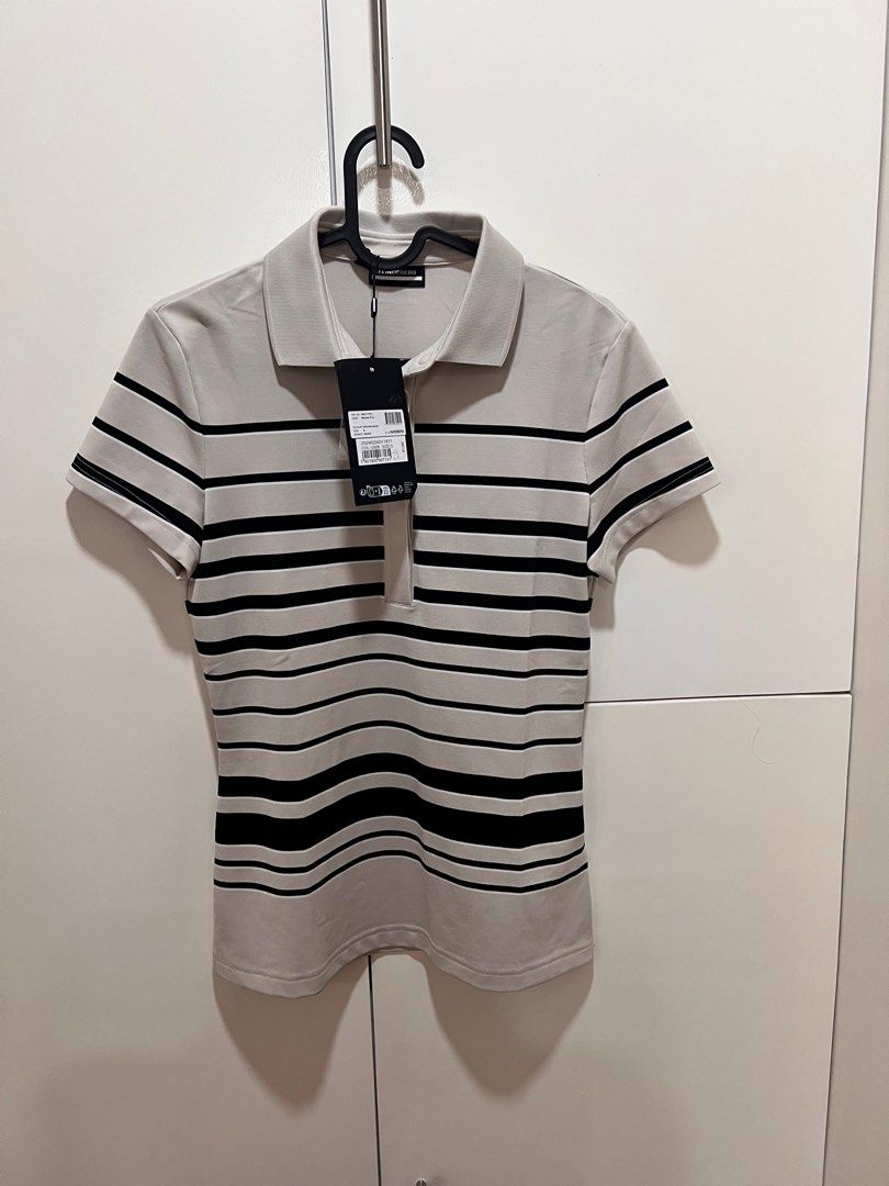 J. Lindeberg Moonbeam Polo Shirt (Category: Blouses) located in Manila. Submitted by jaibarra (Listing ID 1422006338, Image 3). Description: - J. Lindeberg Moonbeam polo shirt - Light beige color with black horizontal stripes - Size: S - Collared neckline - Short sleeves - Button-up placket .