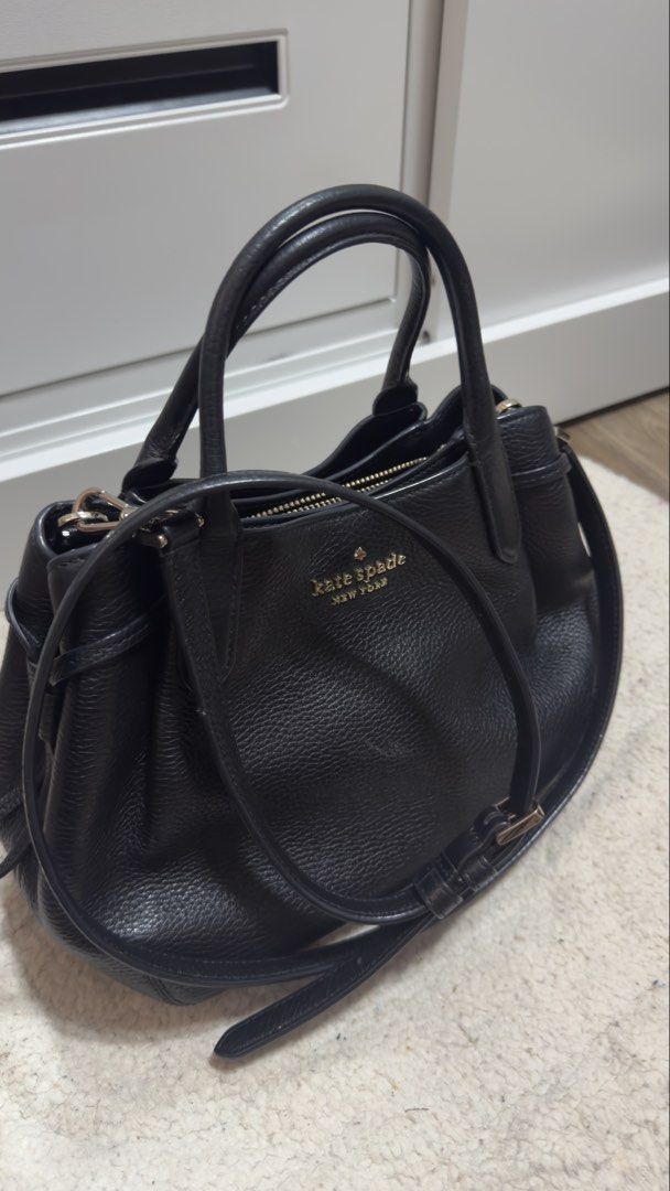 Kate Spade Dumpling Small Satchel (Category: Luxury Bags & Wallets) located in Marikina City. Submitted by machetehmf (Listing ID 1421966930, Image 3). Description: - Black Kate Spade handbag - Top handles and detachable shoulder strap - Secure zip closure - Interior zip pocket - Gold-tone Kate Spade logo - Textured leather finish RFS: Decluttering 😊.