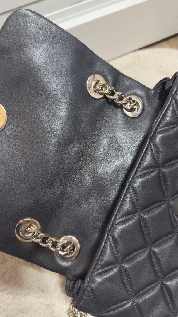Kate Spade Natalia Small Flap (Category: Luxury Bags & Wallets) located in Marikina City. Submitted by machetehmf (Listing ID 1421956297, Image 2). Description: - Kate Spade shoulder bag - Black quilted design - Silver chain strap - Gold-toned square clasp - Flap closure - Interior pocket - Diamond-patterned stitching - Leather material ***Slightly negotiable RFS: Decluttering 😊.