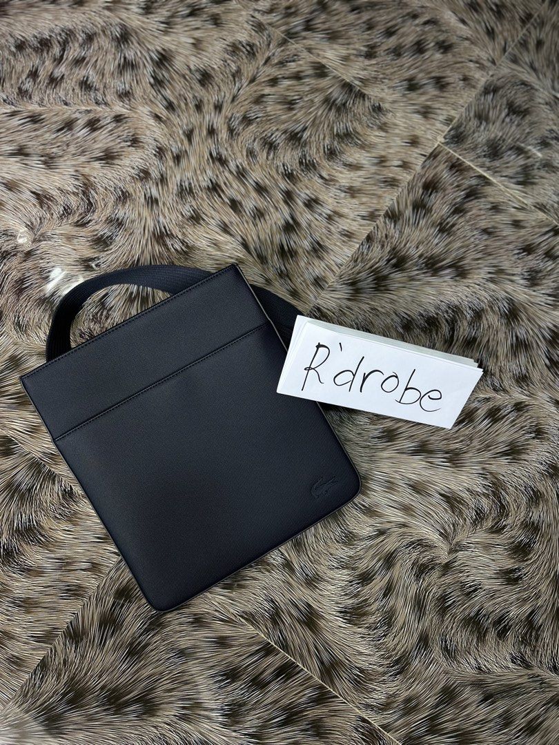 Lacoste Chantaco Flat Shoulder Bag (Category: Luxury Bags & Wallets) located in Baguio. Submitted by Rdrobe (Listing ID 1422004171, Image 1). Description: - Lacoste - Main compartment - Small handle - Subtle Lacoste logo - Textured material - Square shape - Minimalist design.