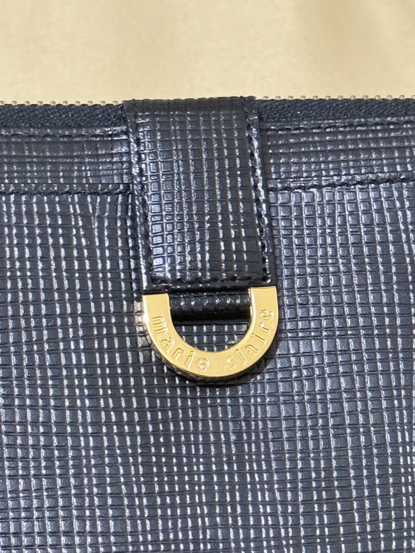 Marie Claire Long Black Leather Wallet (Category: Luxury Bags & Wallets) located in Mandaluyong City. Submitted by stylececilia.ph (Listing ID 1421994698, Image 2). Description: - Marie Claire Paris zip-around long wallet - Saffiano-style leather finish (durable, textured leather that is resistant to scratches.) 10/10 condition No flaws/No stains Zipper is still in good condition Price is negotiable :).
