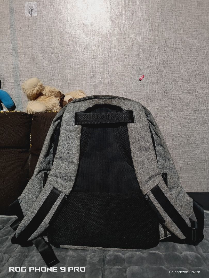 Mark Ryden Anti Theft Backpack (Category: Backpacks) located in General Mariano Alvarez. Submitted by tyronereygalang (Listing ID 1422009759, Image 2). Description: - Mark Ryden Anti-Theft Backpack - Stylish gray and black design - Multiple compartments for organized storage - Dedicated laptop section - Made of durable material - Convenient side zipper pocket - Comfortable padded shoulder straps.