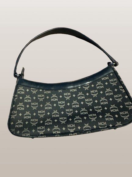 MCM Baguette Vintage Bag (Category: Luxury Bags & Wallets) located in San Fernando. Submitted by iaaasells (Listing ID 1422012567, Image 2). Description: Selling my MCM baguette vintage bag. In good vintage condition. May normal signs of use due to age but no major damage. Zippers and straps are still functional. Compact but kasya essentials like phone, wallet, keys, and lippie. RFS: Decluttering / not being used anymore. 📍Pampanga.