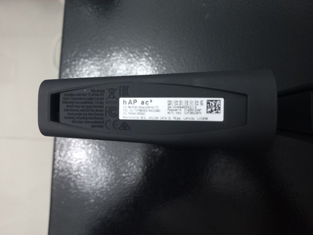 MikroTik hAP ac Wireless Access Point (Category: Networking) located in Makati City. Submitted by zencrystal-3de6cc (Listing ID 1422068976, Image 2). Description: Listing is for a MikroTik hAP ac wireless access point. The device is black and comes in its original packaging. The model name is visible on the device and the box. The device has a label with various specifications and regulatory information..