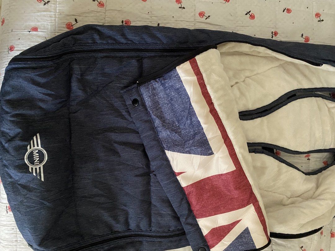 Mini Stroller Footmuff (Category: Strollers) located in Cebu City. Submitted by esmebusiness (Listing ID 1421942197, Image 2). Description: - Navy blue exterior - Soft white interior - Zipper and snap button closure - Features Union Jack design - Designed for stroller use - Keeps baby warm and comfortable.