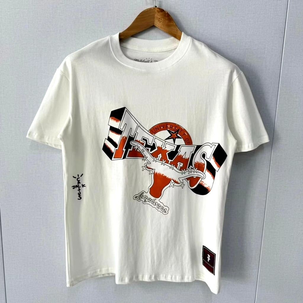 Mitchell & Ness Texas Longhorns T-shirt (Category: Tshirts & Polo Shirts ) located in Makati City. Submitted by stryan (Listing ID 1421983551, Image 1). Description: Official Texas Longhorns collaboration with Travis Scott and Mitchell & Ness. - Features the iconic Texas Longhorns logo. - Includes a small Cactus Jack logo on the sleeve. - Made from a comfortable 50/50 cotton/polyester blend. Condition: 10/10 fitting: small to medium.