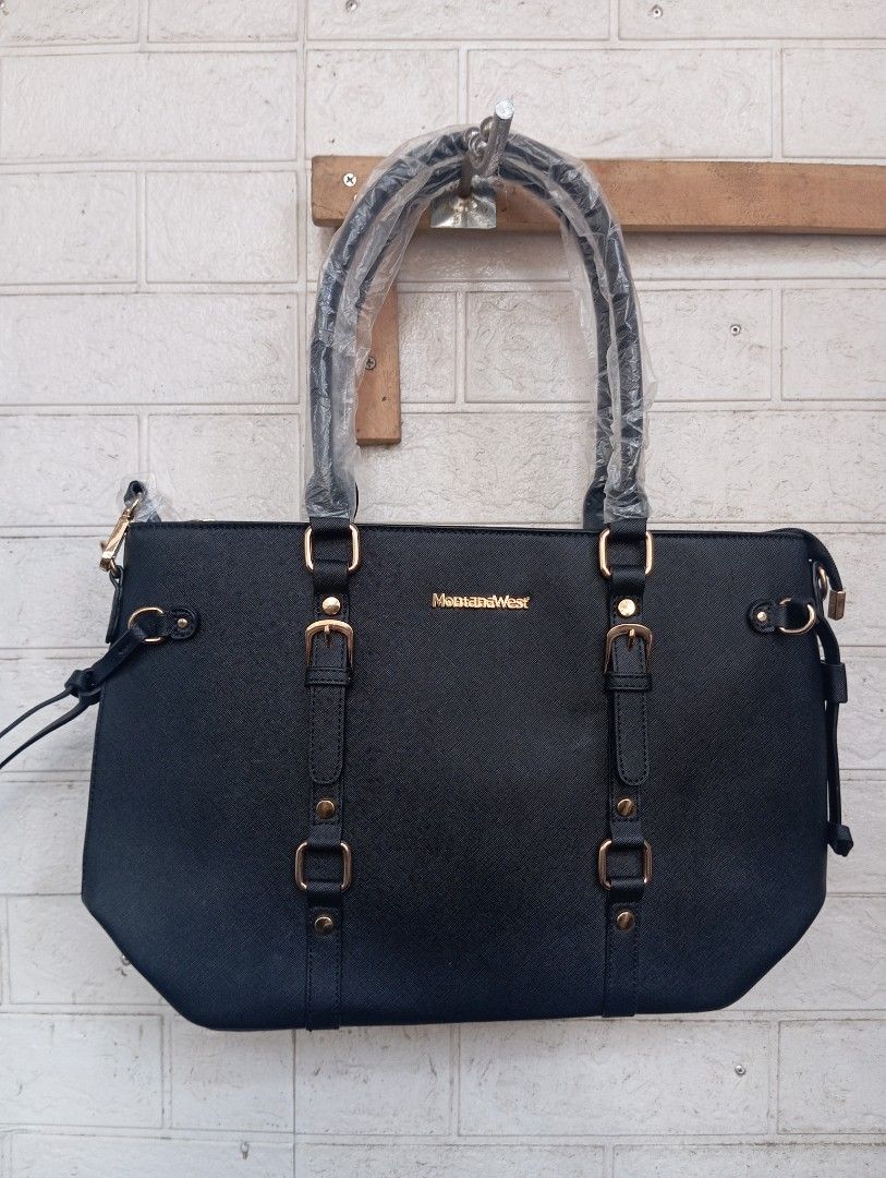 Montana West 2 Way Tote Bag (Category: Tote Bags) located in Quezon City. Submitted by cessswaaa30 (Listing ID 1422057424, Image 1). Description: - L 43cm x W 14cm x H 26.5 cm - with 44.5 " removable strap - Black color 📍Loc.: Commonwealth, Quezon City 📌 Payment via Gcash / Bank (BPI or Maribank) 📌 Shipping via J&T or Lalamove ( fees shall be shouldered by the buyer ).