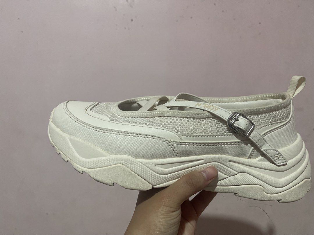 Nerdy Mary Jane Sneakers (Category: Sneakers) located in Manila. Submitted by momscollection.ph (Listing ID 1422057154, Image 2). Description: - White nerdy Mary Jane sneakers - Chunky sole - Mesh detailing - Buckle closure - Brand logo on strap - Pull tab for easy wear - Sporty and feminine design.