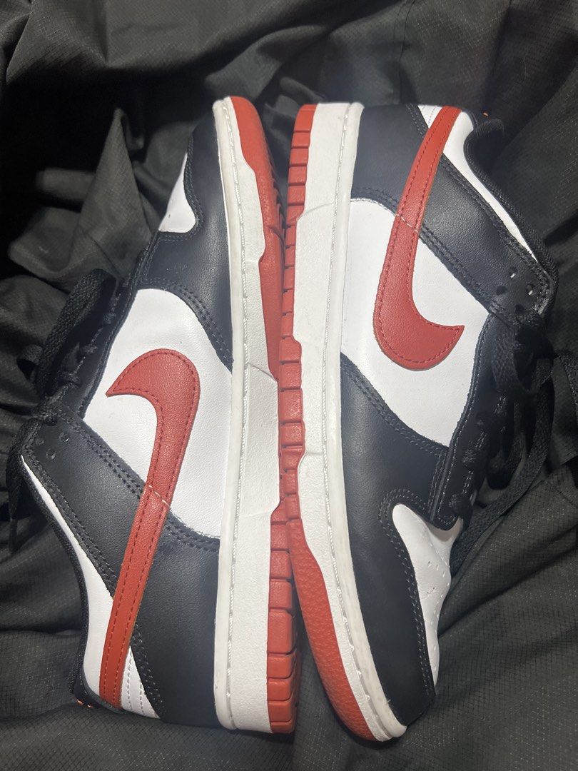 Nike Dunk Low Retro - White/Black/Dragon Red (Category: Sneakers) located in Taguig. Submitted by stuffitlikeitshot (Listing ID 1422020451, Image 2). Description: - Bought in Nike app - Color: White, black, dragon red - Red accents on swoosh and outsole - Nike logo on tongue and insole - Black laces - Used a few times - Minimal heel drags.