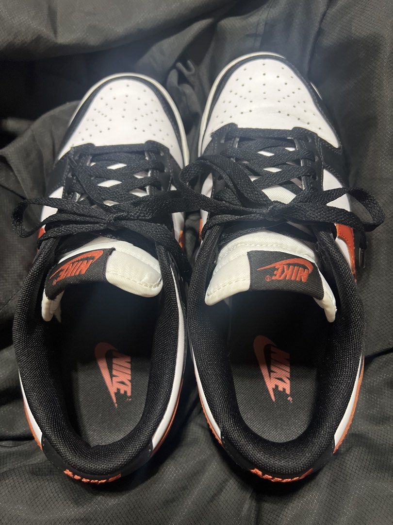 Nike Dunk Low Retro - White/Black/Dragon Red (Category: Sneakers) located in Taguig. Submitted by stuffitlikeitshot (Listing ID 1422020451, Image 1). Description: - Bought in Nike app - Color: White, black, dragon red - Red accents on swoosh and outsole - Nike logo on tongue and insole - Black laces - Used a few times - Minimal heel drags.