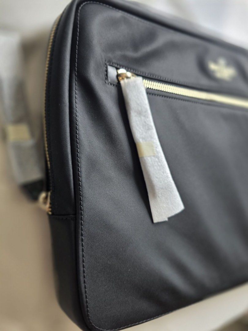 Original Kate Spade Laptop Sleeve with Strap (Category: Laptop Bags & Sleeves) located in Quezon City. Submitted by burpysellsstuff (Listing ID 1421948303, Image 1). Description: - Black Kate Spade laptop sleeve - Gold zipper - Multiple interior compartments - Features Kate Spade label - Includes original tags and packaging - Designed for stylish laptop protection.