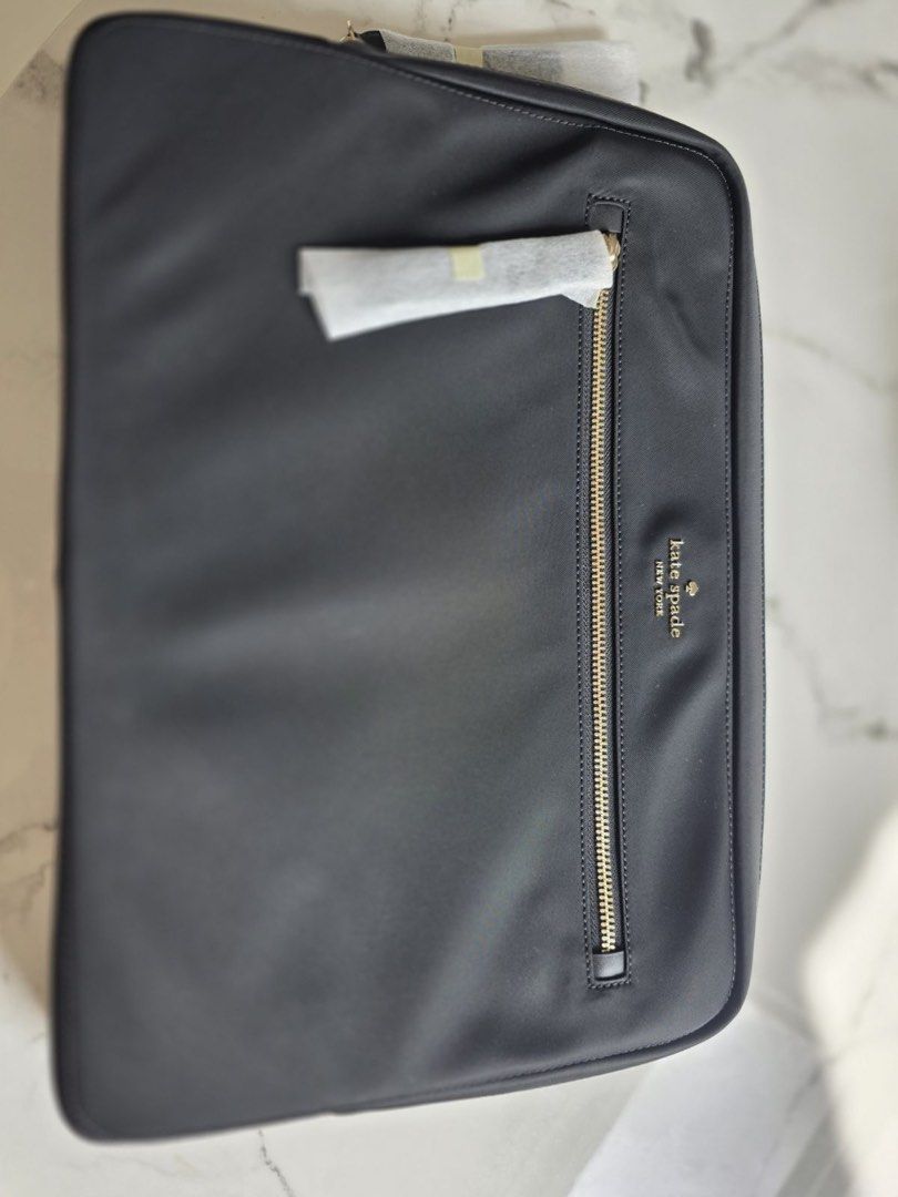 Original Kate Spade Laptop Sleeve with Strap (Category: Laptop Bags & Sleeves) located in Quezon City. Submitted by burpysellsstuff (Listing ID 1421948303, Image 2). Description: - Black Kate Spade laptop sleeve - Gold zipper - Multiple interior compartments - Features Kate Spade label - Includes original tags and packaging - Designed for stylish laptop protection.