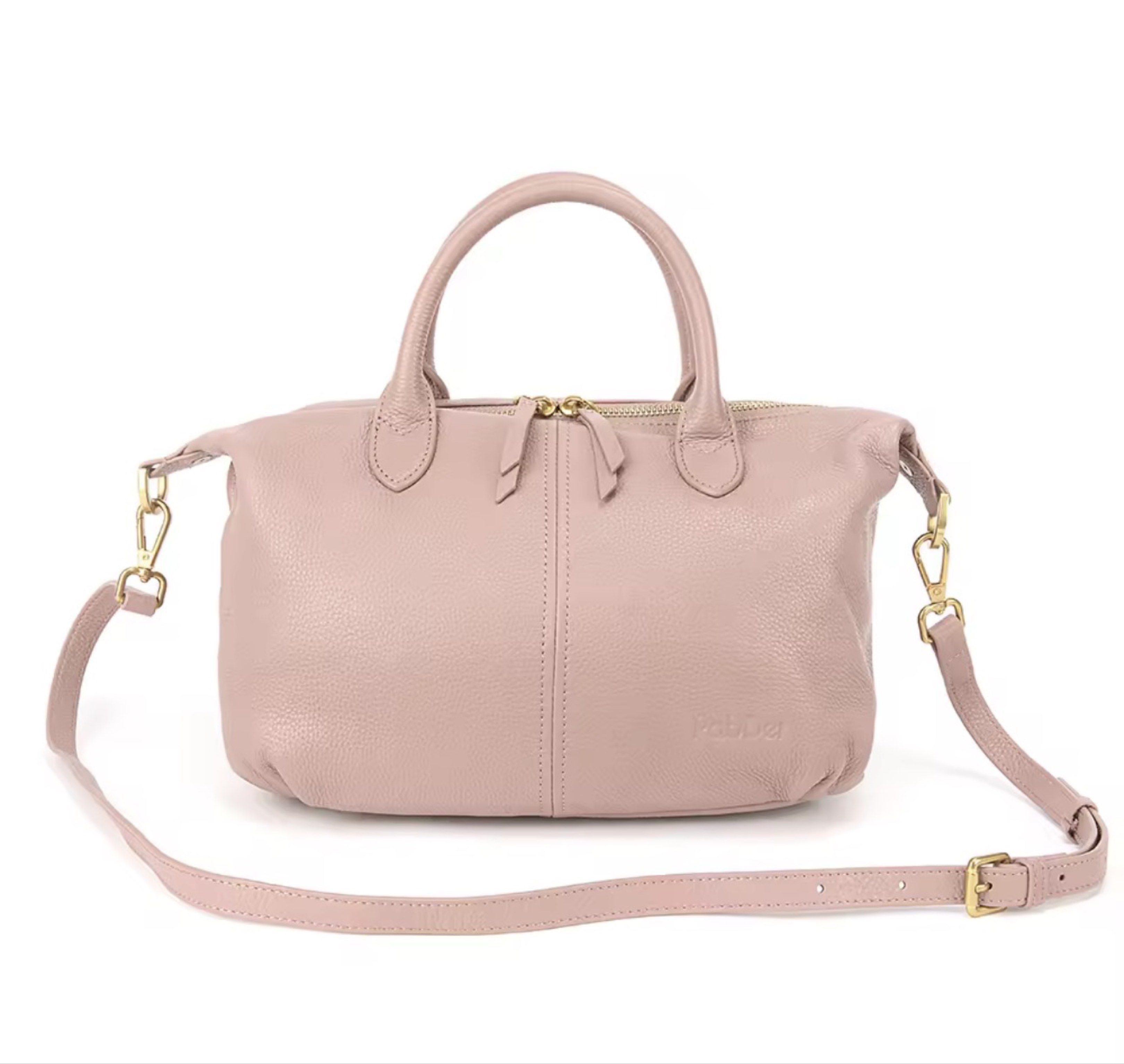 Pab Der Genuine Leather Handbag w/sling (Category: Shoulder Bags) located in Muntinlupa City. Submitted by skylane008 (Listing ID 1421916274, Image 3). Description: - Blush pink Pabder handbag - Structured design - Top handle and detachable shoulder strap - Gold-tone zipper and hardware - Genuine soft leather - Classic and elegant style - Perfect for everyday use - Used once only -in pristine condition -no flaws - free shipping for sure buyer.