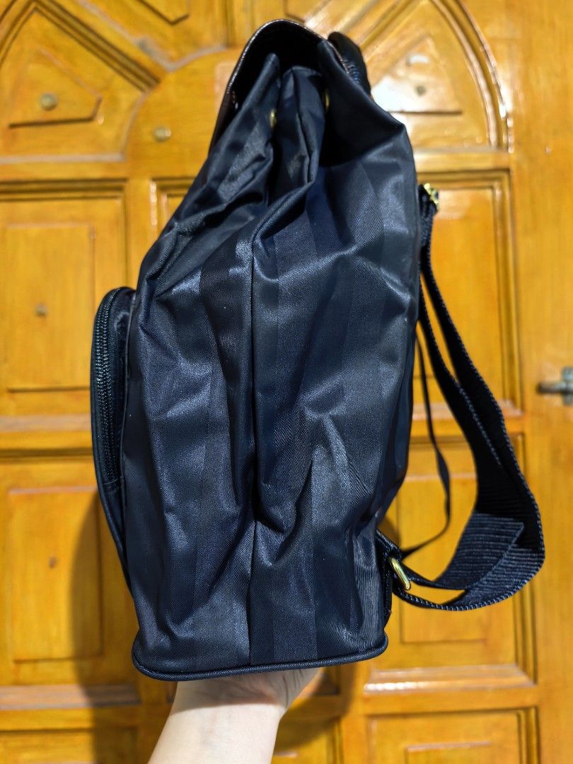Pierre Balmain Paris Backpack (Category: Luxury Bags & Wallets) located in Manila. Submitted by khulet2008 (Listing ID 1422046080, Image 3). Description: - Pierre Balmain Paris backpack - Navy blue with vertical stripes - Front pocket with zipper - Flap closure with button - Adjustable straps - Top handle - Spacious interior.