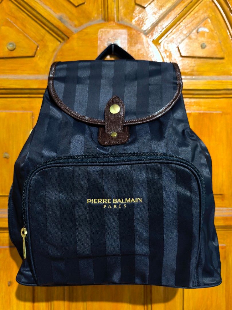 Pierre Balmain Paris Backpack (Category: Luxury Bags & Wallets) located in Manila. Submitted by khulet2008 (Listing ID 1422046080, Image 1). Description: - Pierre Balmain Paris backpack - Navy blue with vertical stripes - Front pocket with zipper - Flap closure with button - Adjustable straps - Top handle - Spacious interior.