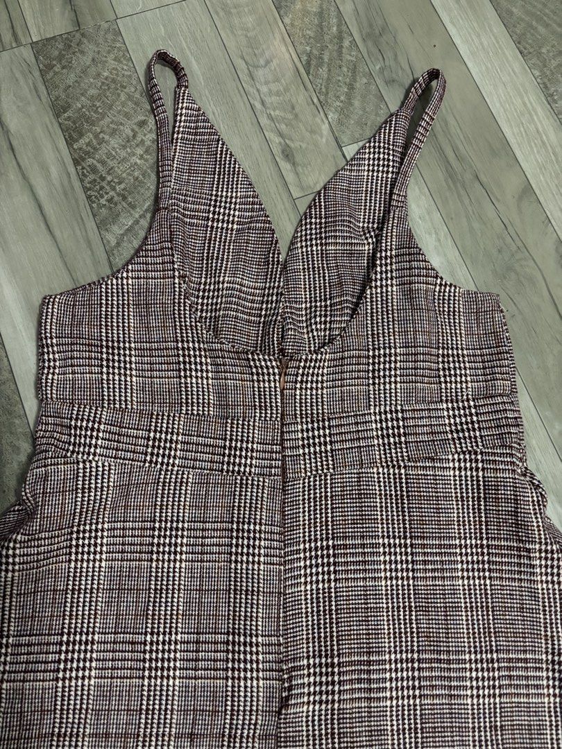 Plaid V-Neck Dress (Category: Dresses) located in Urdaneta. Submitted by zrayray (Listing ID 1422041469, Image 3). Description: - Classic plaid pattern - Flattering V-neck - Fitted bodice - Flared skirt - Back zipper closure - Medium-weight fabric - Suitable for various occasions.
