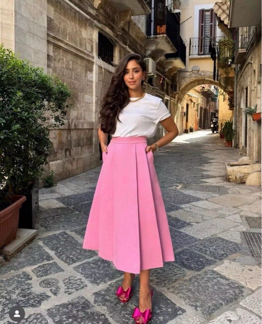 Pleated Midi Skirt - Pink (Category: Skirts) located in Makati City. Submitted by zaraprelove12345 (Listing ID 1421984141, Image 3). Description: - Elegant pink midi skirt - Pleated design - High-waisted - Flowy silhouette - Dress up or down - Suitable for casual or formal events.
