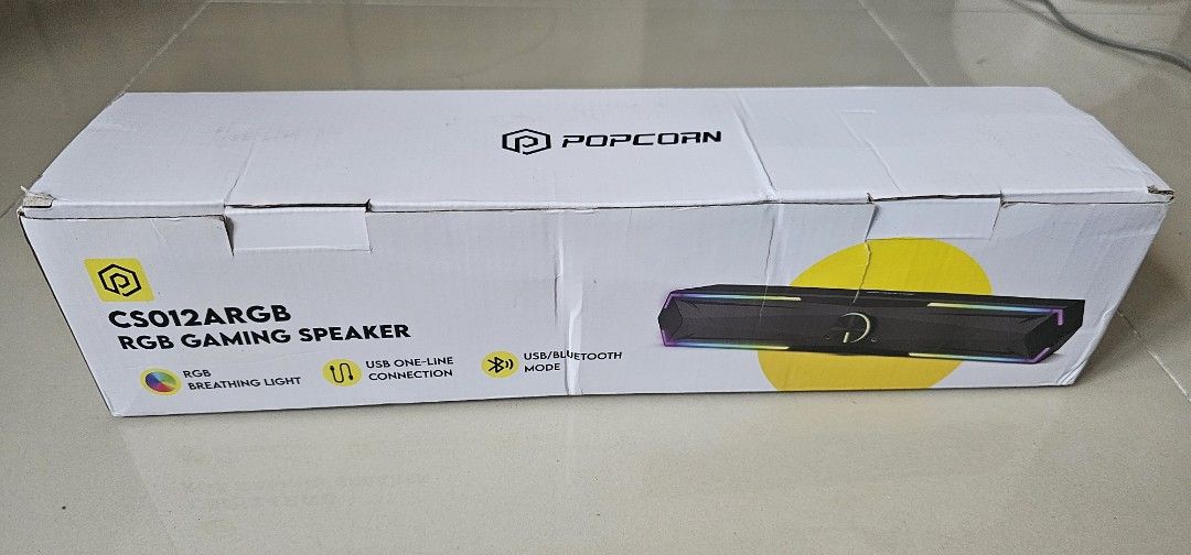 Popcorn CS012ARGB RGB Gaming Speaker (Category: Soundbars, Speakers & Amplifiers) located in Marikina City. Submitted by anbierose (Listing ID 1421954709, Image 1). Description: - Popcorn CS012ARGB Gaming Speaker - RGB Breathing Light - USB and Bluetooth Modes - Volume Control Knob - Audio Input/Output Ports - Includes USB Cable and User Manual - Sleek Black Design.