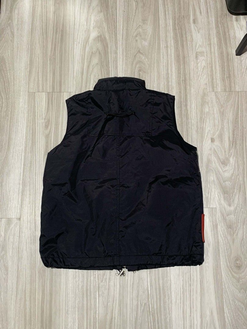Prada Hooded Nylon Red Tab Camouflage Vest (Category: Vests) located in Naga. Submitted by unknwnstreetwear (Listing ID 1422077263, Image 2). Description: NO ISSUE AS NEW CONDITION WIDTH-20 INCHES LENGTH-23 INCHES.
