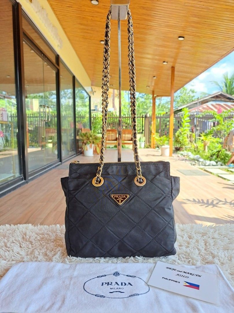 Prada Quilted Chain Shoulder Bag (Category: Luxury Bags & Wallets) located in Tagum. Submitted by marny0503-00673 (Listing ID 1421977921, Image 1). Description: 💠💠💠 Authentic/Original 💠💠💠 Black Nylon Tessuto Chain Shoulder Bag, Pre-owned‼️‼️👜👜 Inclusions: ✅️ COA (to be provided) ✅️ Dustbag ✅️ Paypal deduction ➕️ shipping fee depends on the country through DHL. Tariff is excluded. ✈️ USA is 6️⃣2️⃣💰 ✈️ Asia is 4️⃣6️⃣💰 ✈️ Local is Free ✈️ 