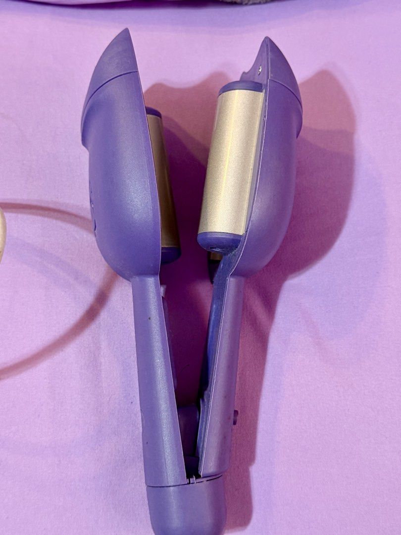 Purple Hair Waver (Category: Hair) located in Las Pinas. Submitted by mjm21 (Listing ID 1421945889, Image 3). Description: - Purple hair waver for creating wavy or mermaid hairstyles - Comfortable handle - Easy power button - Stylish paw print design - power cord.
