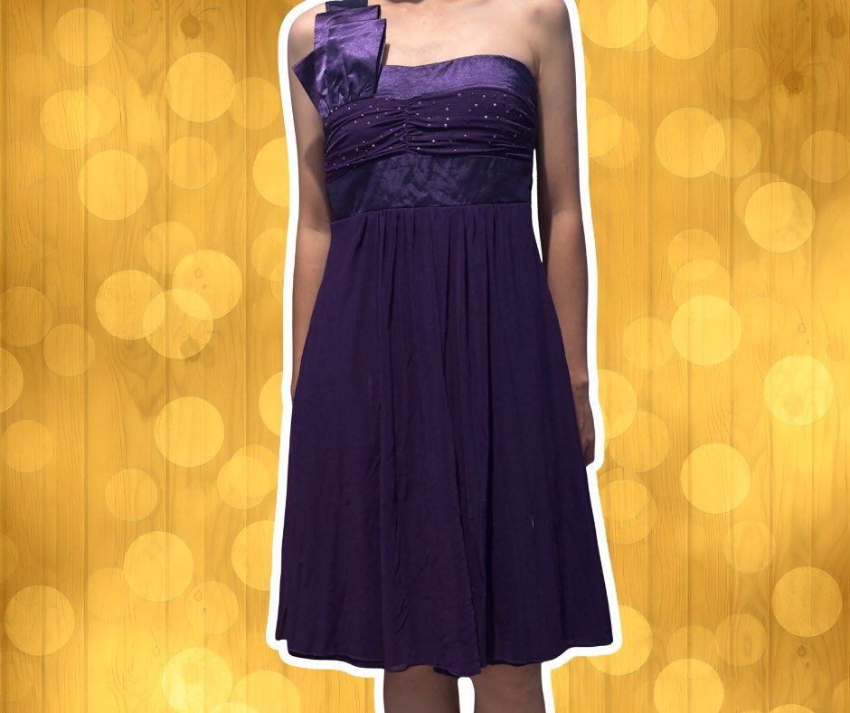 Purple One-Shoulder Cocktail Dress (Category: Dresses) located in Manila. Submitted by congressyardsale (Listing ID 1421957665, Image 1). Description: ✨ Elegant purple cocktail dress ✨ Flowing, knee-length skirt ✨ Perfect for special occasions.