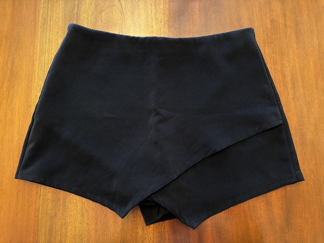 Sandwiches Clothes Black Wrap Shorts (Category: Shorts) located in Mandaue City. Submitted by marginiz (Listing ID 1421957079, Image 1). Description: Black wrap shorts from Sandwiches Clothes. Made in Thailand. Features a zipper closure at the back. The waist measures approximately 14 inches across. The length from the waist to the hem is approximately 13 inches. Room 1111 is printed on the tag..