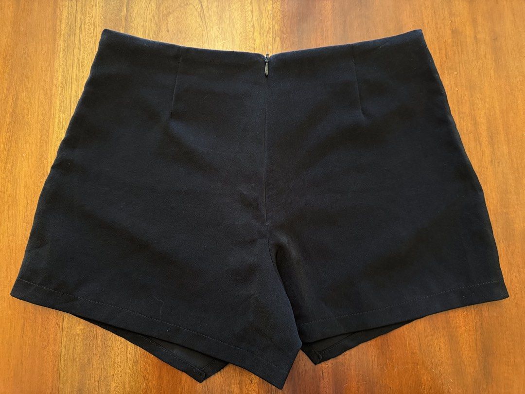 Sandwiches Clothes Black Wrap Shorts (Category: Shorts) located in Mandaue City. Submitted by marginiz (Listing ID 1421957079, Image 3). Description: Black wrap shorts from Sandwiches Clothes. Made in Thailand. Features a zipper closure at the back. The waist measures approximately 14 inches across. The length from the waist to the hem is approximately 13 inches. Room 1111 is printed on the tag..