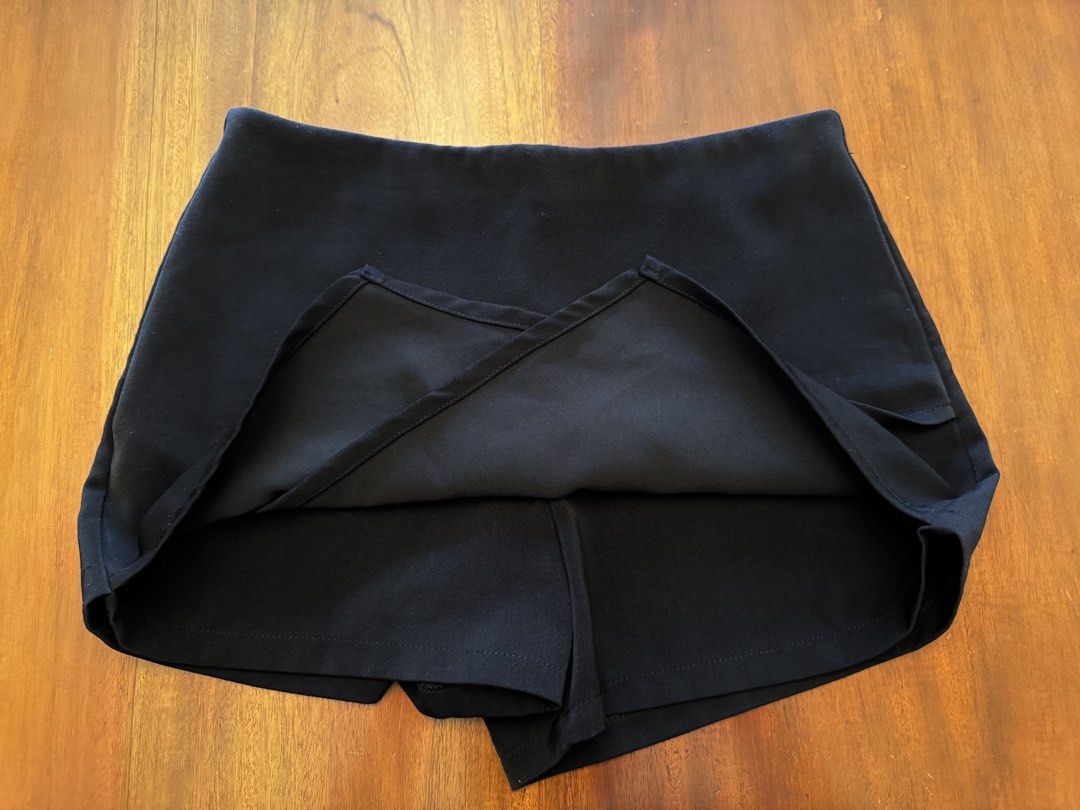 Sandwiches Clothes Black Wrap Shorts (Category: Shorts) located in Mandaue City. Submitted by marginiz (Listing ID 1421957079, Image 2). Description: Black wrap shorts from Sandwiches Clothes. Made in Thailand. Features a zipper closure at the back. The waist measures approximately 14 inches across. The length from the waist to the hem is approximately 13 inches. Room 1111 is printed on the tag..